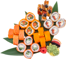 Overhead view of set of sushi rolls served on bamboo leaves