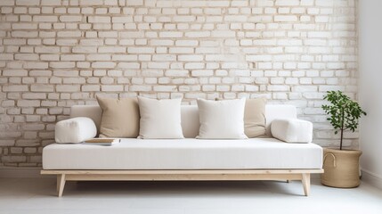 Modern white couch on simple pine frame, against a white washed brick wall with potted tree