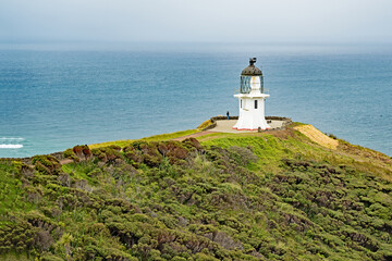 The lighthouse at Cape Reinga, in the far north of New Zealand and where the Tasman Sea and the Pacific Ocean meet.