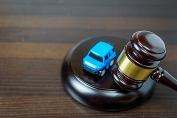 Concept of automobile auction. Judge's mace on a table in a court of law The concept of sale of an...