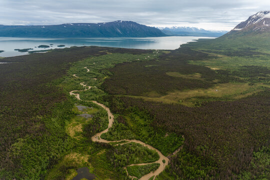 Chekok Bay on Lake Iliamna in Alaska. Aerial view of braided and winding river and the mouth on Lake Iliamna, Alaska's largest lake. 