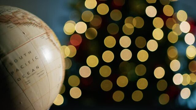 Moving map of the world with Christmas background 