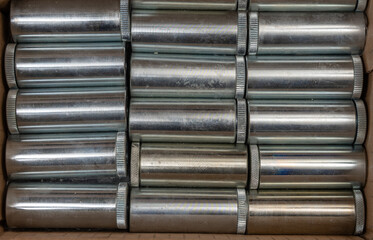 Background of many cylindrical metal repeating products processed on the machine