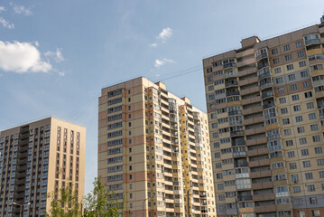 Multi-apartment modern residential buildings standing next to each other.