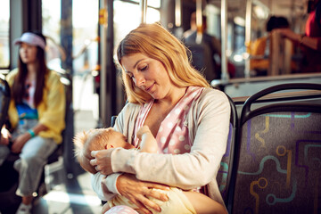 Woman Nursing Baby on Public Transit