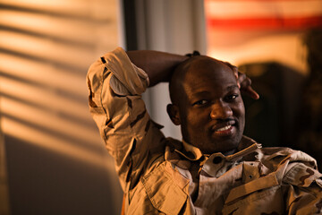 Soldier in uniform indoor looking at camera