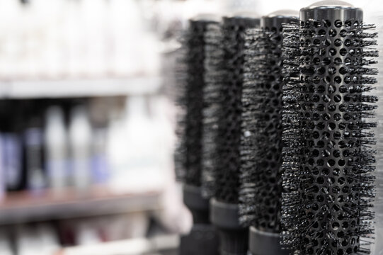 Combs in a hairdressing store. Blurred background.