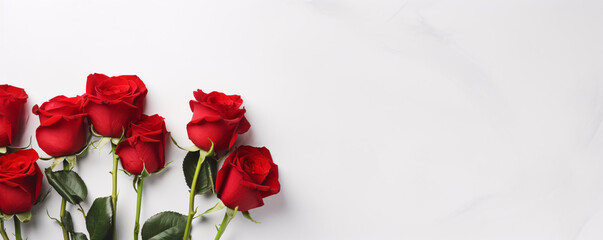 Naklejka na ściany i meble Bouquet of red roses on white marble background. Beauty and romance theme. Valentine's day celebration. Design for love-themed events, greeting card, banner with free space for text