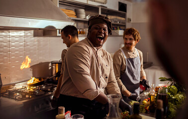 Young male chefs working in the kitchen