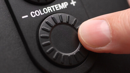 Rotating the Color temperature Control Dial with Finger. Close-up, shallow dof.
