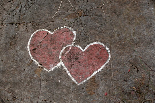 Two hearts painted on a granite wall