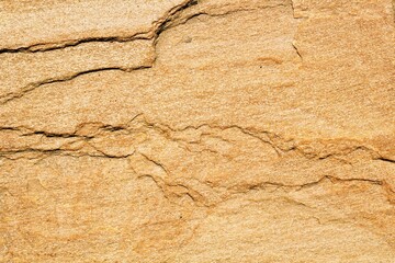Mountain rock texture. Natural brown slate granite slab marble stone ceramic seamless tile rough surface background. Architecture grunge modern abstract style element. Close-up, copy space