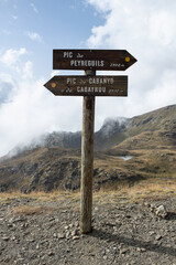 The wooden sign post located on the border between Andorra and France helps us take the right direction