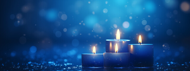 Flaming candles at night on dark blue background with lights. Candles in Christian church as...