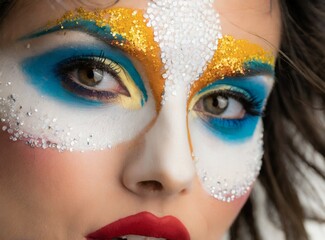 Carnival makeup, makeup art, female model face colorful carnival makeup design closeup