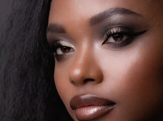 Black female model, beauty makeup, face closeup