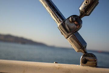 Ball and joint for ship holder with sea in the background as engineering technology in statics