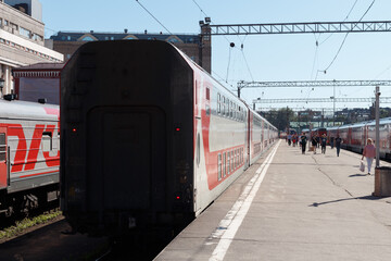 Departing passenger train from the station during the day. Moscow, Russia, June 17, 2021.