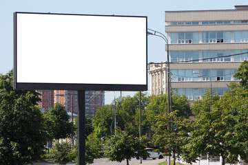 Large billboard in the city in summer, horizontal. Mock-up.