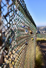 chainlink fence with assorted love locks