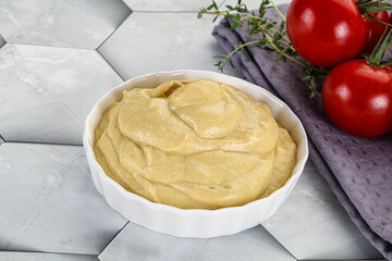 Dijon mustard sauce in the bowl