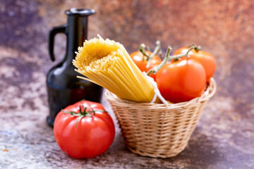 Spaghetti with tomatoes in a rustic basket