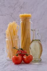 hole spaghetti and bunches of tomatoes