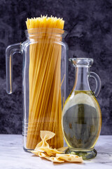 Whole spaghetti and bottle of oil