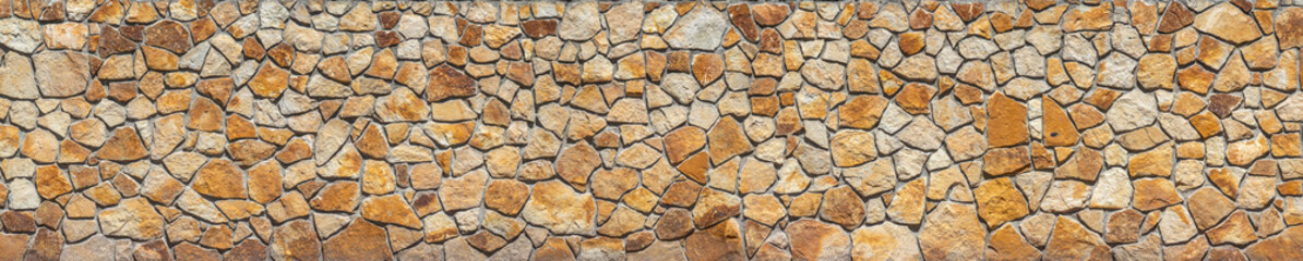 Rugged Charm: Stone Slate Wall Bathed in Natural Light