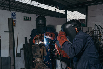 Welding students in the workshop