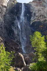 Fotobehang Famous Bridal Veil Fall or Waterfall Vertical Portrait, Low Autumn Water Flow, Granite Rock Cliff. Yosemite National Park, Sierra Nevada California USA © Autumn Sky