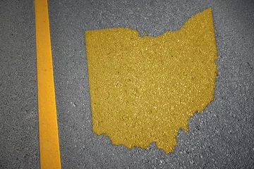 Fotobehang yellow map of ohio state on asphalt road near yellow line. © luzitanija