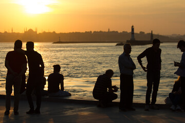 People watching the panorama of Istanbul from Kadıköy at sunset