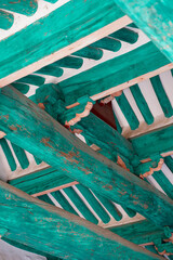 a beautiful traditional Korean hanok.
a turquoise wooden rafter.