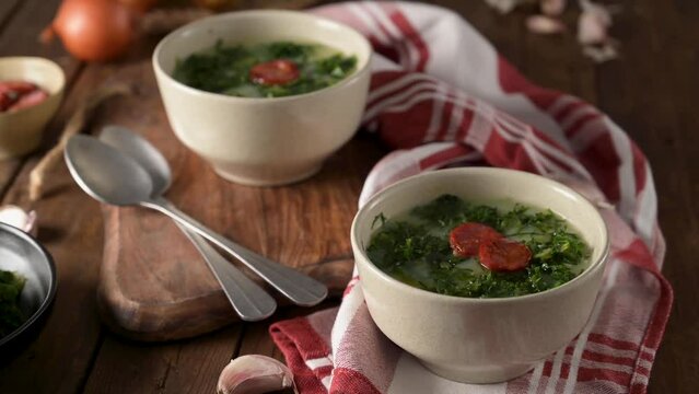 Caldo verde popular soup in Portuguese cuisine. traditional ingredients for caldo verde are potatoes, collard greens , olive oil and salt. Additionally garlic or onion may be added.