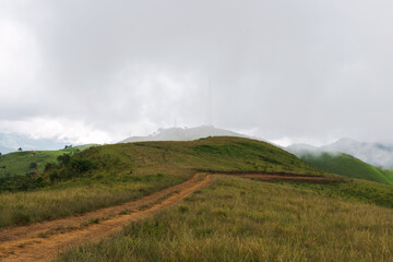 An electric tower on top of hill