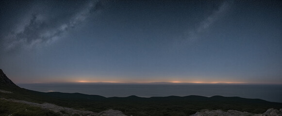 Sea and night sky with milky way, stars, view from a hill, stars are slightly visible in the sky, distant mountains on the horizon, distant sunset on the horizon