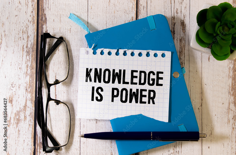 Poster knowledge is power text on sketching notebook with many light bulbs