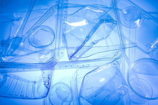 Clear plastic food containers backlit with blue gels