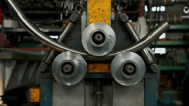 Industrial bender equipment machine for metal pipe bending in the factory. Creative. Automatic metalworking machine.
