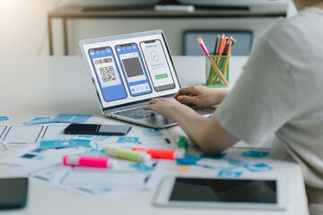 Creative UX UI designer working on screens for mobile responsive website development, focusing on...
