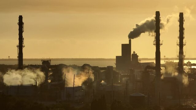 Industrial facility for chemical production of phosphoric acid polluting atmosphere with toxic emissions. Mosaic Riverview Plant in Tampa, Florida. Factory for handling and processing of phosphates