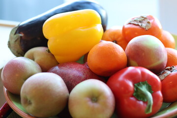 A plate of whole fruits and vegetables