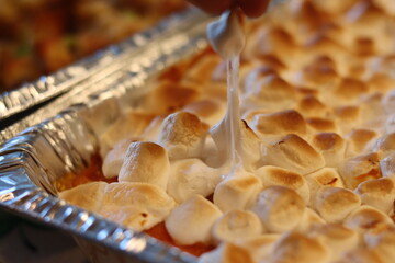 Delicious toasted marshmallows on top of sweet potato casserole - obrazy, fototapety, plakaty