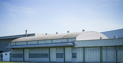 Fototapeta premium ฺฺBuilding and steel structure factory with the blue sky, The roof of the factory.