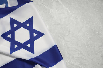Flag of Israel on grey marble background, top view and space for text. National symbol