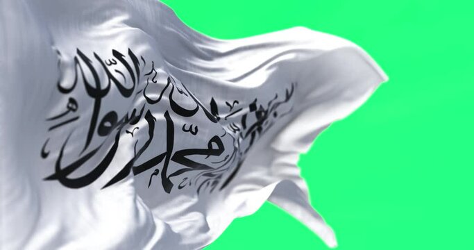Flag of Islamic Emirate of Afghanistan waving in the wind on green screen
