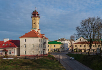 Fototapeta premium View of the Fire tower on Zamkova Street on a sunny day, Grodno, Belarus