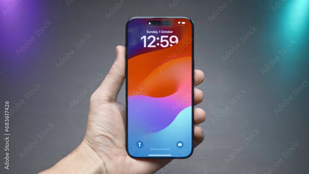 Poster close-up of phone screen with time. action. stylish phone lock screen saver. man holds stylish phone