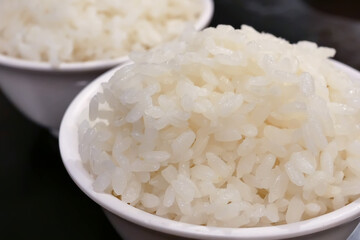 Close up bowl of cooked rice on table